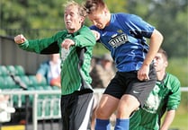 Town book match against mighty Greens