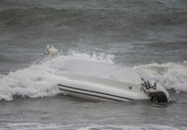 RNLI lifeguards rescue two after RIB capsizes