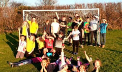 Village celebrates new goal posts with kids vs adults football game