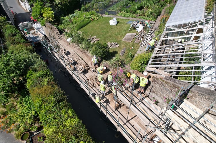 Workers repairing wall in Stoke Fleming