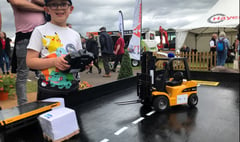 Mini forklifts on trade stand pull in young fans