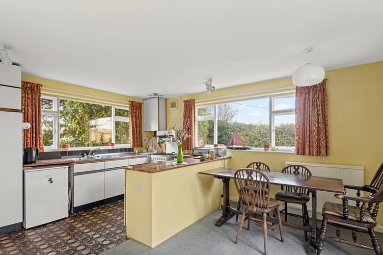 Original brown lino flooring in the kitchen of the 1970s house in Salcombe, Devon. See SWNS story SWLNhouse. An incredible 'time warp' 1970s home with original patterned wallpaper, lino and apricot tiles has gone on the market - for £1million. The four bedroom property was originally built in the seventies and has been with the same owners for almost 40 years. The house is described as being "ready for modernisation" but some 70s fans may want to leave the decor exactly as it is.