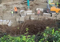Wall comes down at housing development