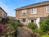 Cottage for sale is 300 years old with a babbling brook in the garden