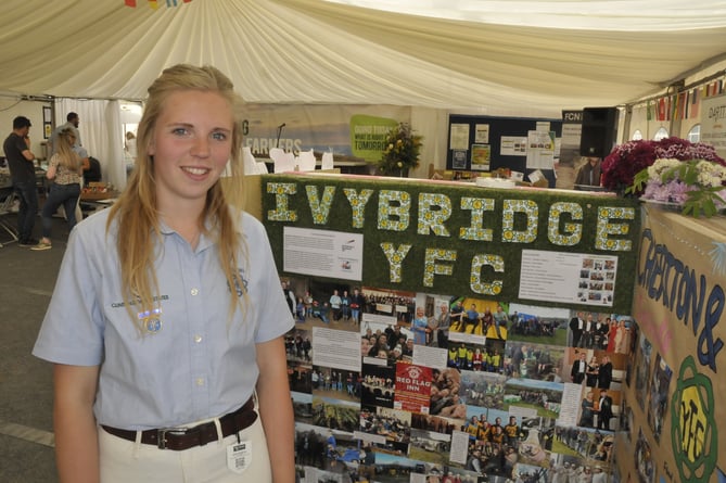 Ivybridge YFC Chairman, Kayleigh Lovegrove, with her club's display at the Devon County Show 2023.