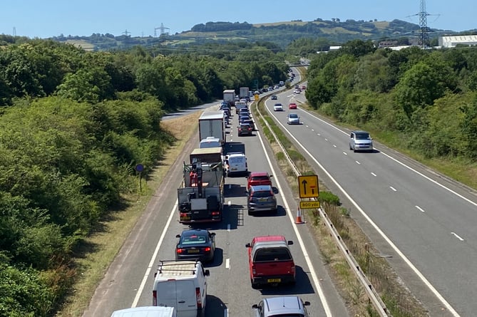 GRIDLOCK: Traffic was still queuing as far back as Chudleigh on the A38 at Noon today following the overnight crash on the A38. A lorry overturned and a recovery operation is in progress.
Picture: Steve Pope (7-7-23)