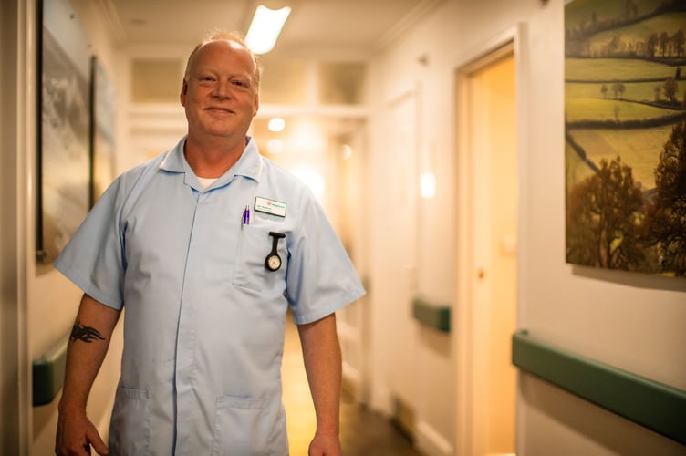 Nurse Ian in the ward corridor in Searle House.
