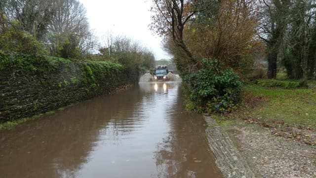 Drivers warned to slow down on flooded roads 