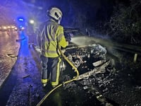 Firemen put out car blaze on A38