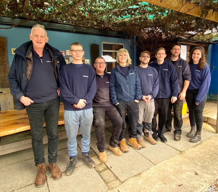 Landworks founder Chris Parsons (left) with trainees and staff