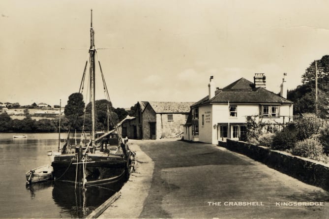 The Crabshell Inn and Bonds Quay, Kingsbridge with a sailing boat *Bertie* by the quay. View to the northwest.  
Originally the New Quay Inn, it was locally known as "the Crabshell" for years before officially being renamed. 