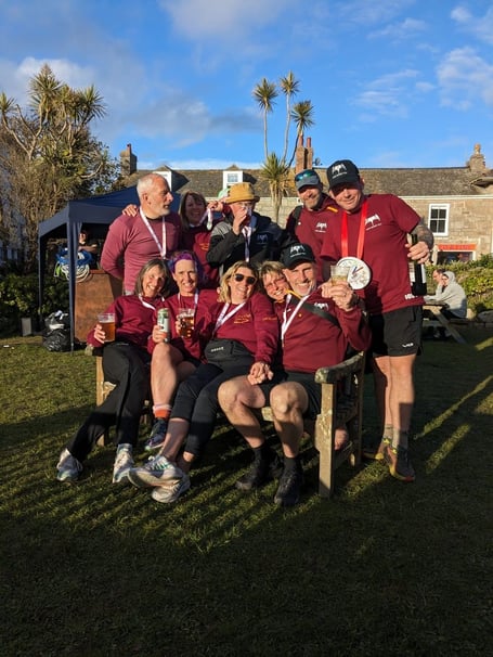 Members of the Dartmouth men's and women's pilot gig teams celebrate