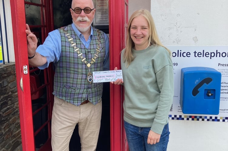 Cllr Philip Cole presents a cheque to Lauren Taylor