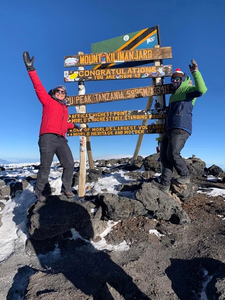 Sophie. and Lawrence Weeks reach the summit of Mount Kilimanjaro