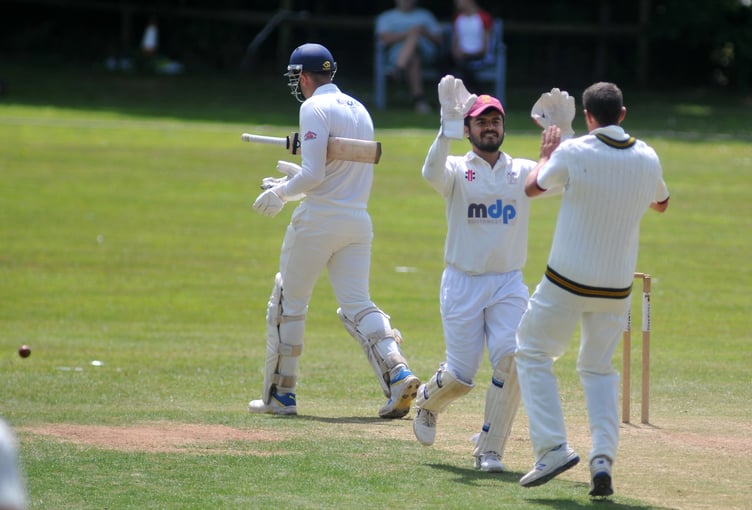 Devon Cricket League B Division. Ipplepen versus Stoke Gabriel. Stoke 'keeper Abhishek Anand happy at catching J Colgate out off a ball from Mike Smith.