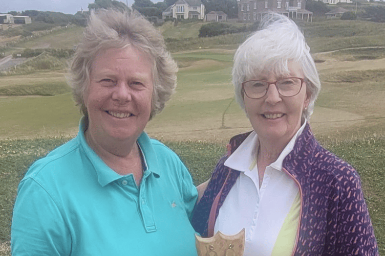 Ladies' captain Pam Adams presents Irene Lowry with the Betty Ord Memorial trophy