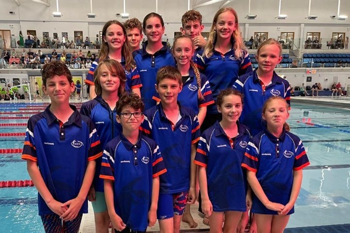 13 of Kingfishers' 17-strong team pause for a team photo at the Life Centre