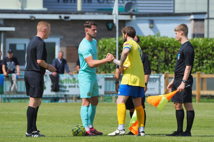 Ivybridge Town and Bridgwater United captains shake hands ahead of the season opener