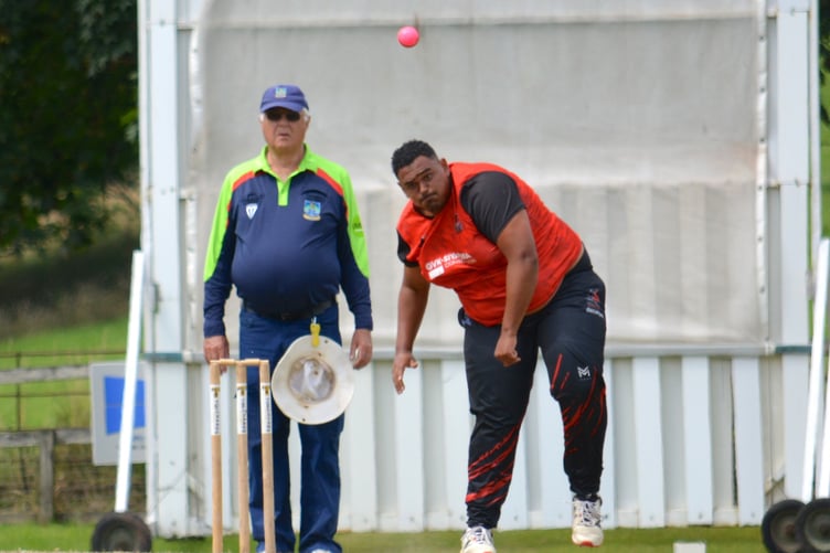 Stoke Gabriel spinner Justin Pringle bowling against Cullompton in the Corinthian Cup semi-final at Sandford