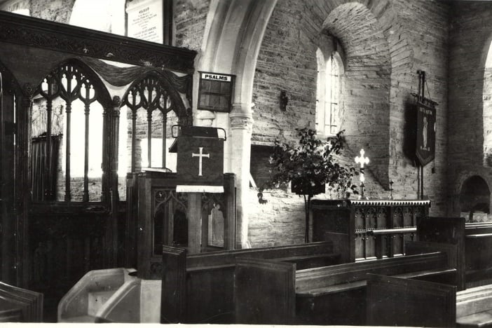 Black & white postcard. Interior view of the Lady Chapel, All Saints Church, South Milton.