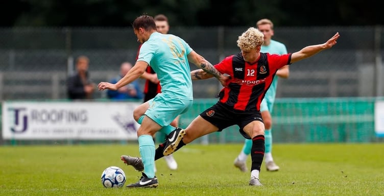 Ben Fowles in the thick of it for Tavistock AFC vs Ivybridge Town