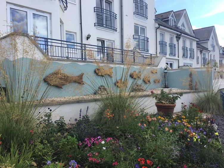 The wooden sculptures were installed on an external wall adjoining the Moorings Reach estate