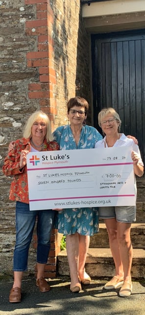 Committee members:Carol Gameson- Hughes, Jan Clarke and Jo Wells handing
 over the £700 cheque to St Luke’s Hospice.