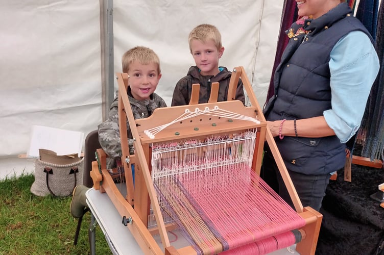 Albie 5, Harry Davis 8 & Kelly showing how to weave