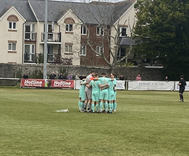 Ivybridge Town huddle before kick off against Newton Abbot Spurs