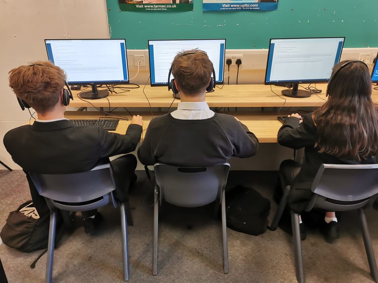 Action tutoring students at work