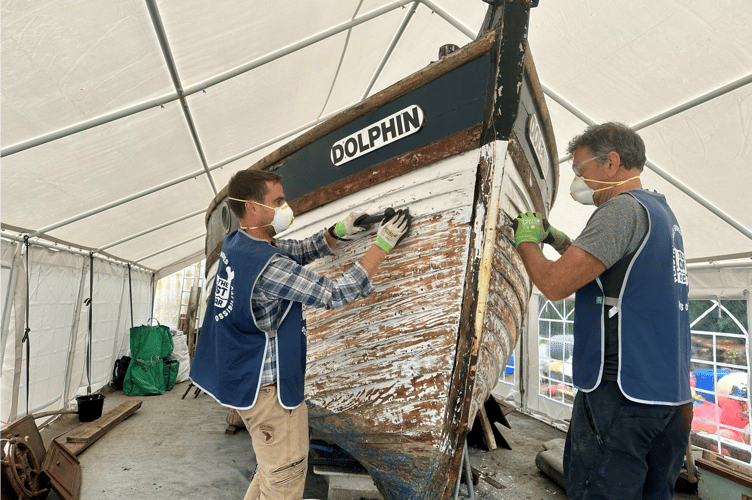 Volunteers working on restoring Dolphin Project