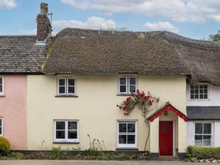Period cottage for sale overlooking stream is full of "timeless charm"