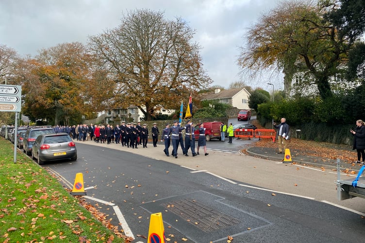 The parade approaches the War Memorial