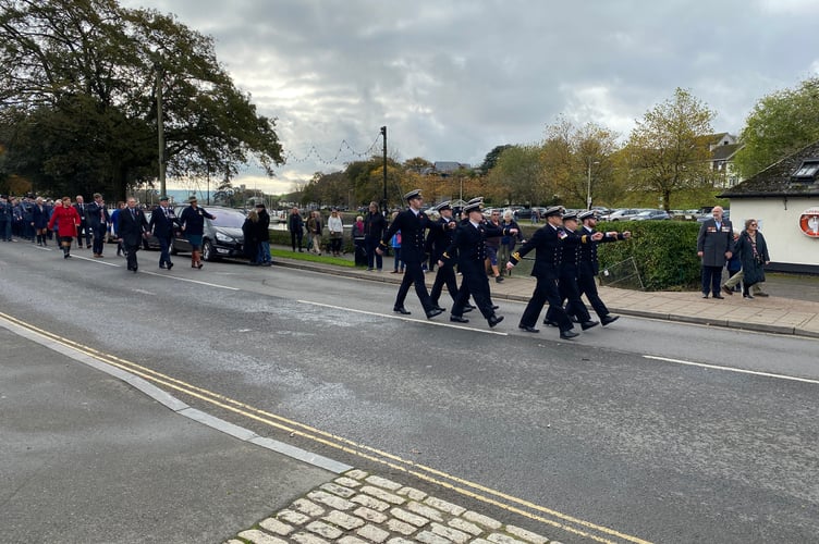 Naval officers march by 