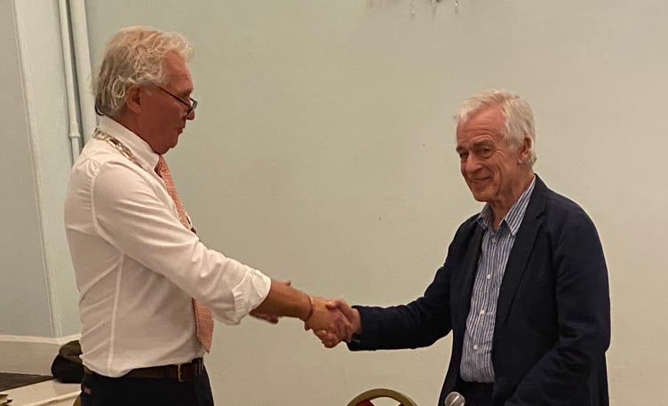 Salcombe Mayor Mark Goodey (L) presents the Chair of Salcombe Maritime Museum Roger Barrett (R) with Salcombe Citizen of the Year Award