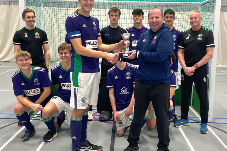Sol Bloomfield, Ashmoor's U18 Captain receives the West Winners Cup from Tournament Manager Rich Hill
