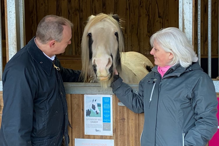 Mr Davey and Ms Voaden with one of the centre's horses