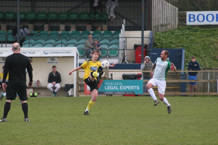 Buckland Athletic 2s player brings the ball down well in midfield