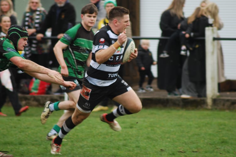 Captain Ben Large breaks through to score Lydney's first try. Picture: Roger Pike.