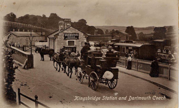 Dartmouth Coach approaching Kingsbridge railway station with passengers around 1900. Train and wagon already waiting.