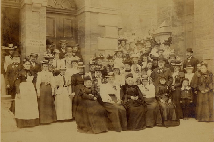 Group of people outside the Police Station in Fore Street Kingsbridge (now the Town Hall)