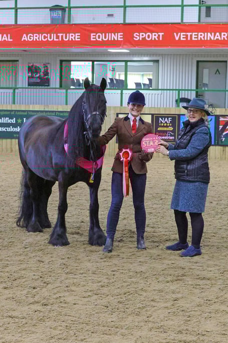 Alexandra Whitell and Kalmara Felicity receive their prize from Amanda Gomersall.