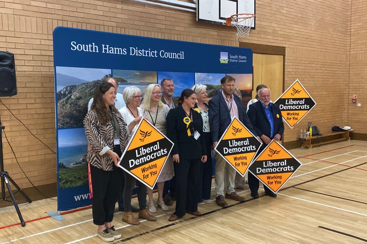 Lib Dem members pose for group shot after another win