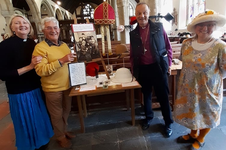 Revd Jax Tilbury, Chris Stephens and Mandy Sargeant of Dodbrooke  Church with the Bishop of Exeter, who brought a along a mitre for the Hats Off exhibition