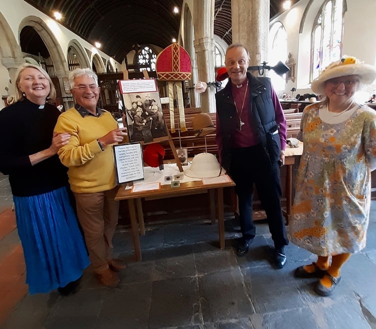 Revd Jax Tilbury, Chris Stephens and Mandy Sargeant of Dodbrooke Church with the Bishop of Exeter, who brought a along a mitre for the Hats Off exhibition