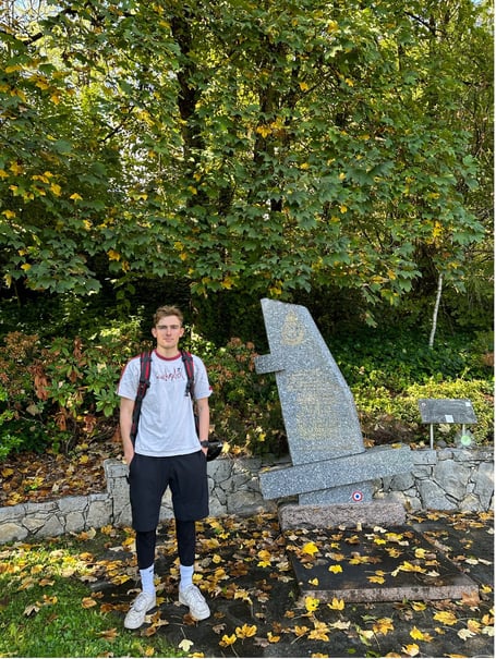 Adam at crash site with memorial