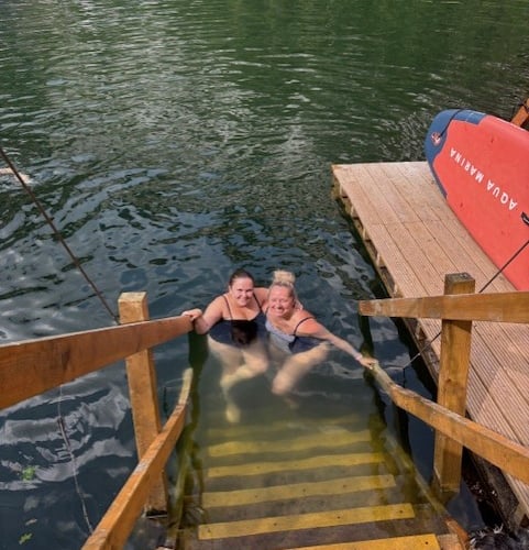 Bluewater Hays Travel’s Kathleen Kennedy-Parkes (right) and Layla Shoveler embarking on their sponsored cold water swim