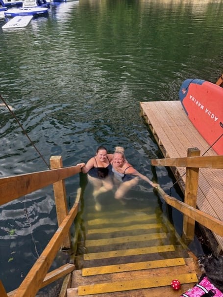 Bluewater Hays Travel’s Kathleen Kennedy-Parkes (right) and Layla Shoveler embarking on their sponsored cold water swim