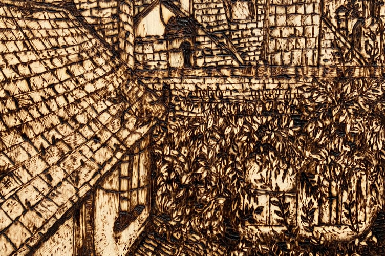 Jay Fennell, 15, was the winner of the older age category of 2023 with his depiction of the view from his window, using a technique of applying burning marks into wood called pyrography.