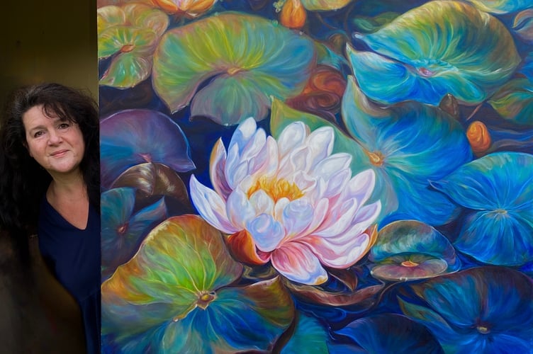 Anita Nowinska with her big waterlily flower painting- Fortitude.
